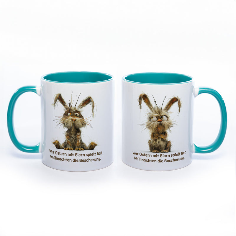 Motiv - Tasse mit Spruch und Hase: Wer Ostern mit Eiern spielt hat Weihnachten die Bescherung.- spülmaschinenfest