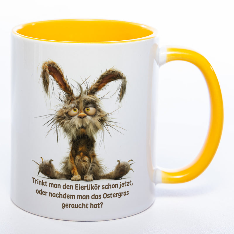Motiv - Tasse mit Spruch und Hase: Trinkt man den Eierlikör schon jetzt, oder nachdem man das Ostergras geraucht hat? spülmaschinenfest