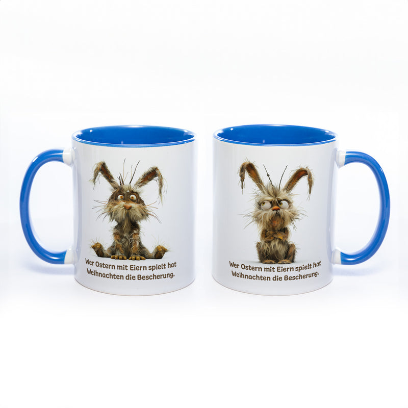 Motiv - Tasse mit Spruch und Hase: Wer Ostern mit Eiern spielt hat Weihnachten die Bescherung.- spülmaschinenfest